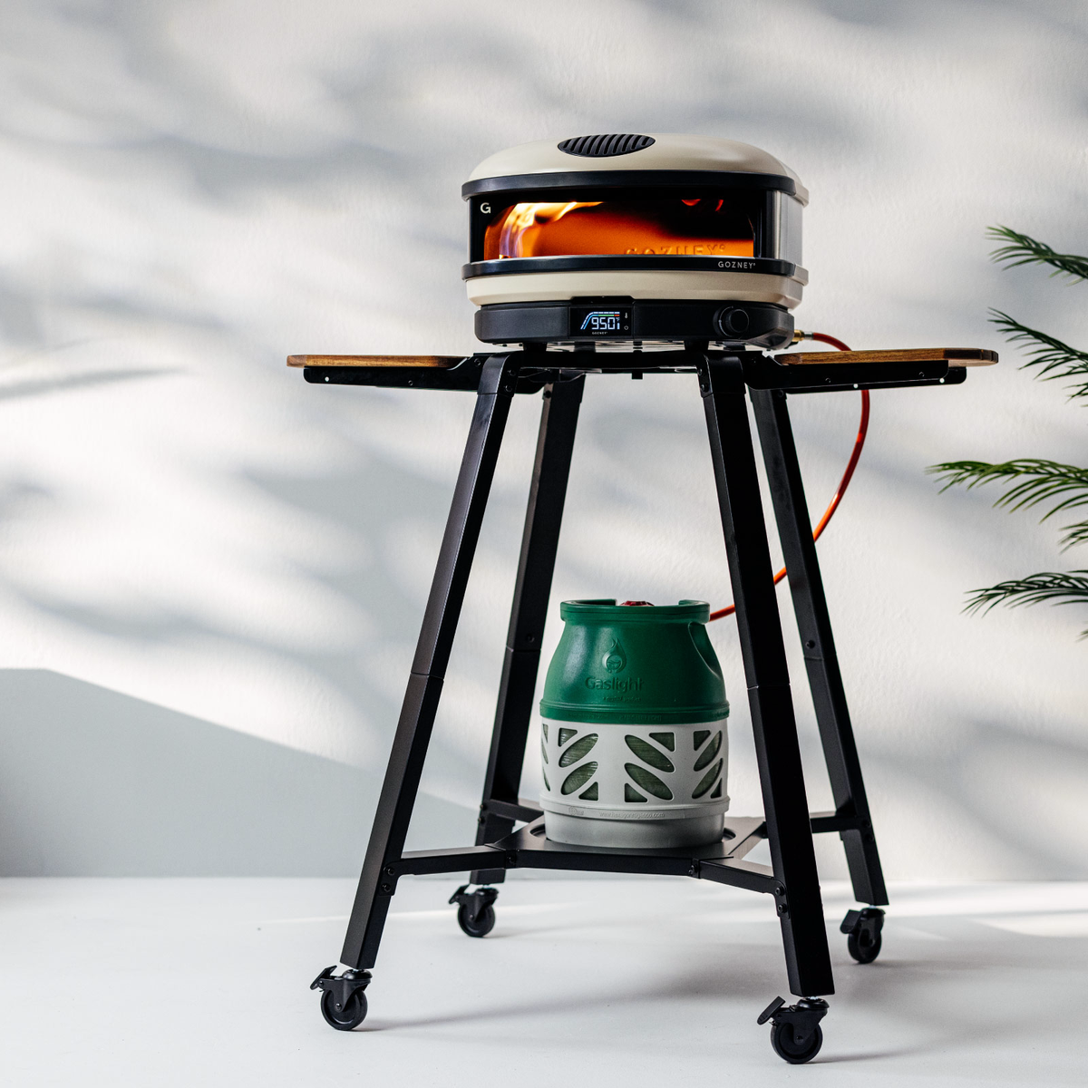 Gozney Arc + Arc XL Stand with an oven and gas bottle on a patio