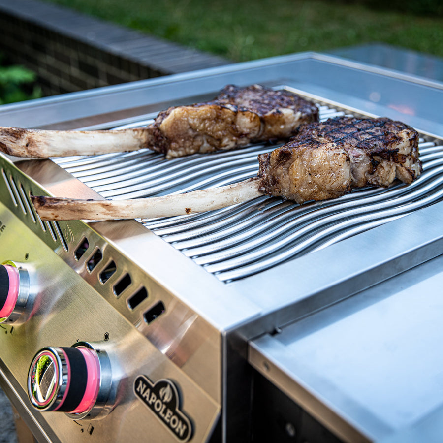 Napoleon 18 inch dual infrared side burner with two SIZZLE ZONE burners searing steaks