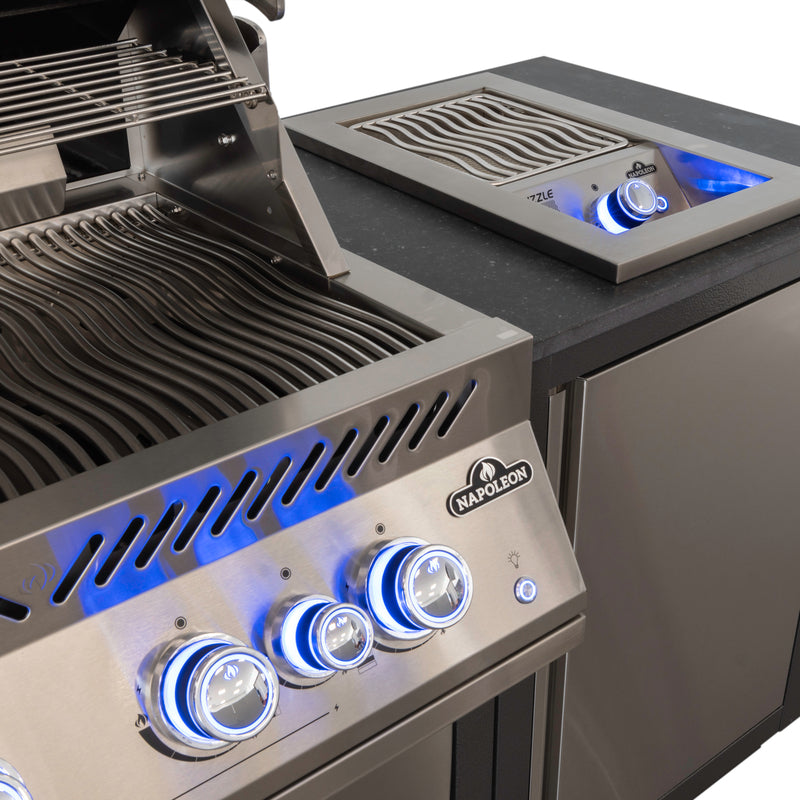 Napoleon 10 inch infrared side burner installed beside a built-in grill in an outdoor kitchen