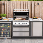 Napoleon Prestige PRO 500 Built-In with the lid open and food grilling, in an outdoor kitchen
