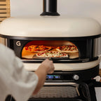 Two pizzas baking side by side in the Gozney Dome XL (Gen 2)