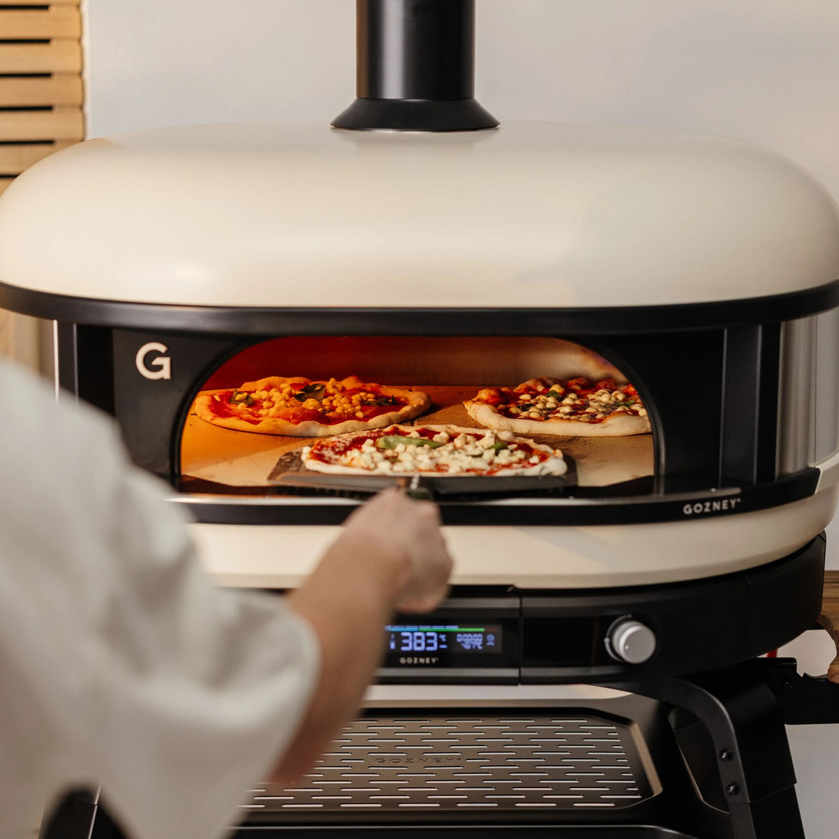 Two pizzas baking side by side in the Gozney Dome XL (Gen 2)
