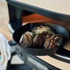 Cast iron pan of roasted vegetables cooking in the Gozney Dome (Gen 2)