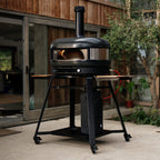 Gozney Dome XL (Gen 2) in Off Black on a stand on a patio