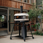 Gozney Dome XL (Gen 2) in Bone on a stand on a patio