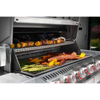 Food cooking on the Napoleon Prestige PRO665 Elite Smart with the lid open
