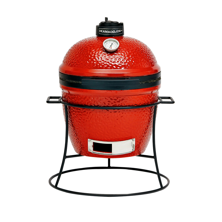 Kamado Joe Junior ceramic charcoal grill in red on its stand