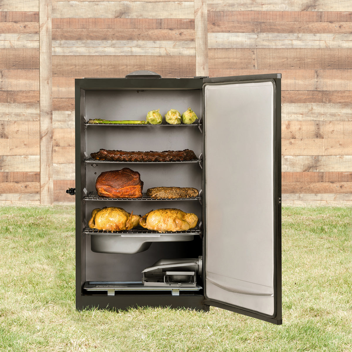 Masterbuilt 40 inch electric smoker open and full of food in a garden