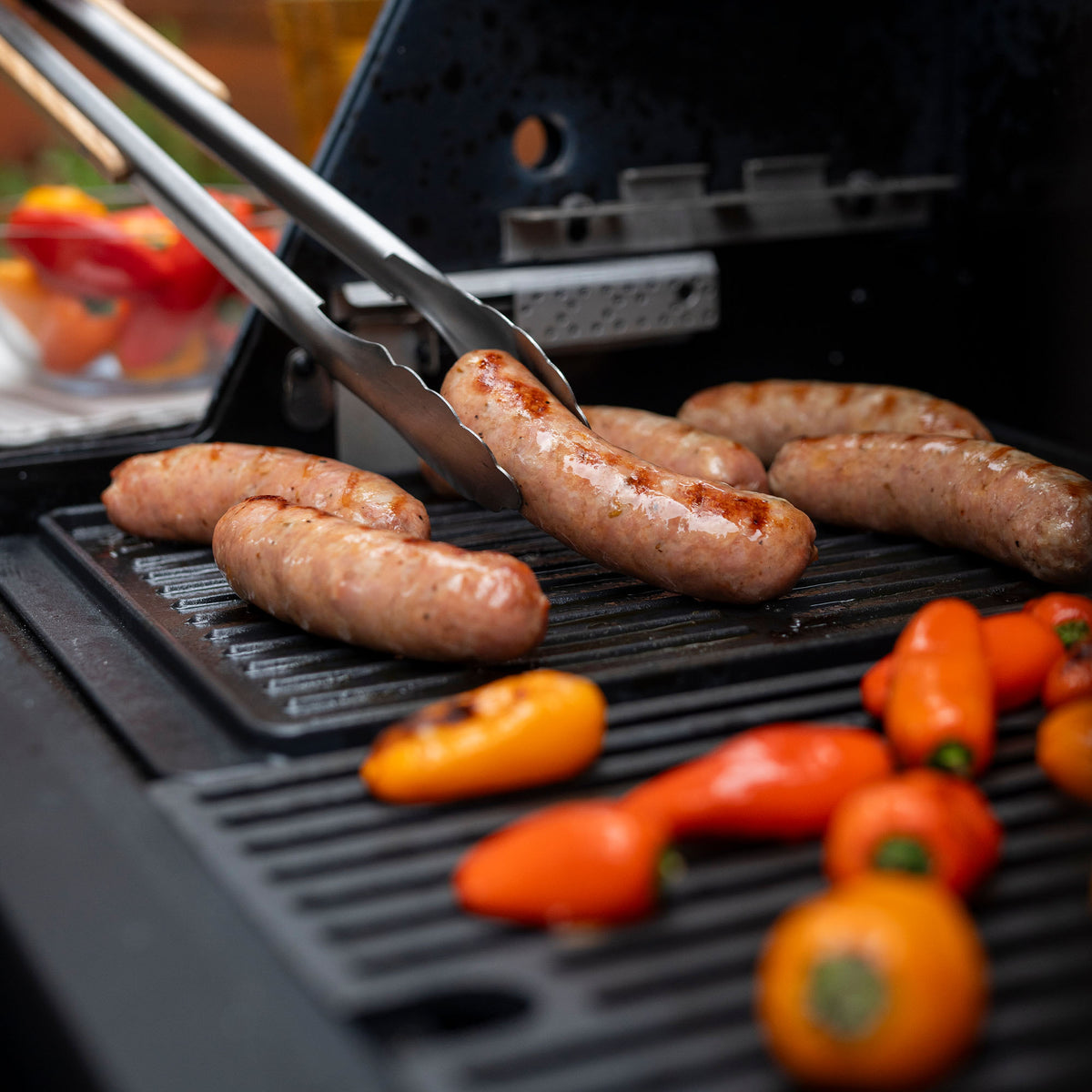Sausages and peppers on the Masterbuilt half-grate griddle insert