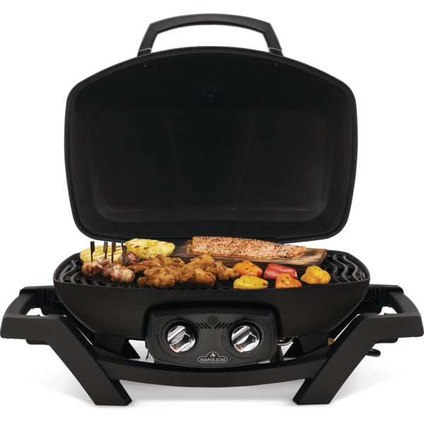 Napoleon TravelQ PRO285 with the lid open, cooking salmon and vegetables