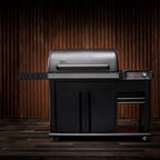 Traeger Woodridge Elite against a dark wooden backdrop