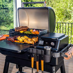 Traeger Ironwood cooking a full grill of food on a terrace