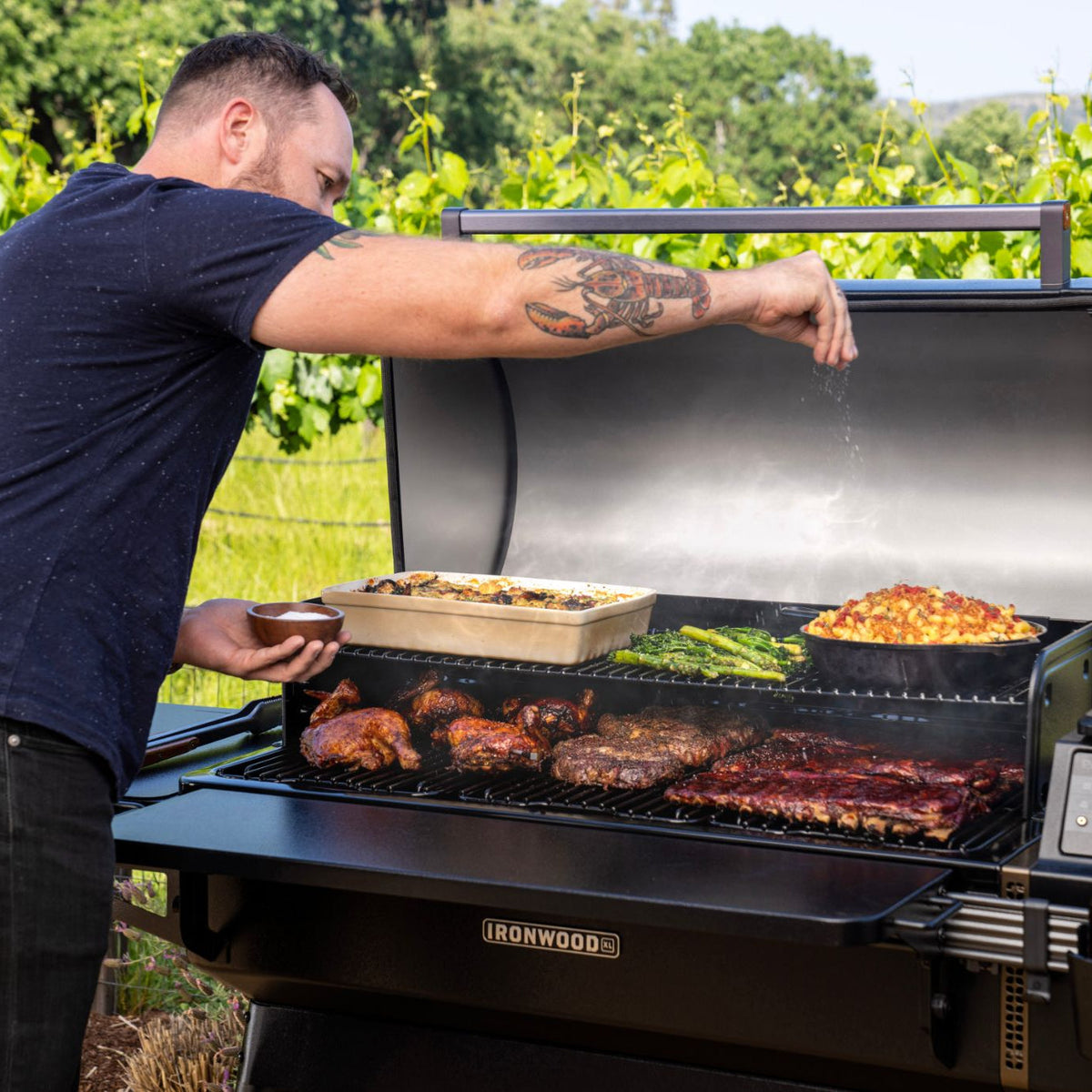 Man cooking on the Traeger Ironwood XL outdoors