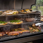 Fish, steak and vegetables cooking on the Traeger Timberline XL
