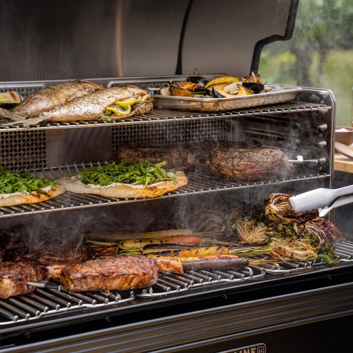 Fish, steak and vegetables cooking on the Traeger Timberline XL