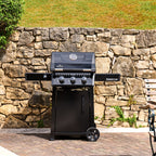 Napoleon Freestyle 365 Gas BBQ on a patio in front of a stone wall
