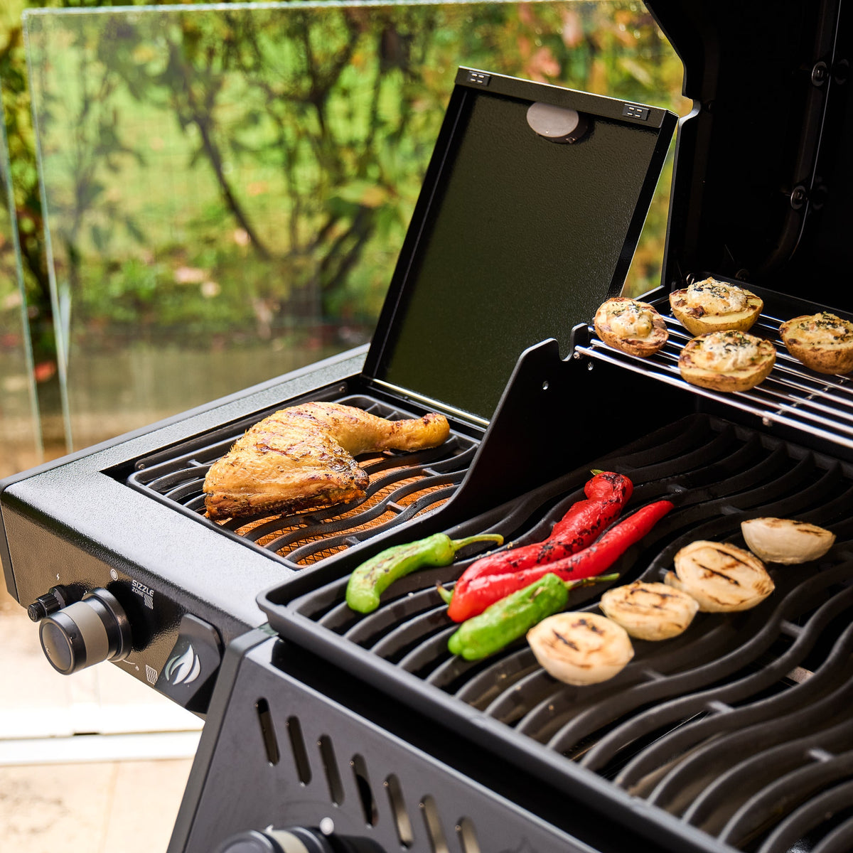 Chicken, peppers and mushrooms cooking on the Napoleon Freestyle 365 SIB