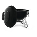 Napoleon NK14 Portable Charcoal Kettle with the lid hung on the side of the bowl